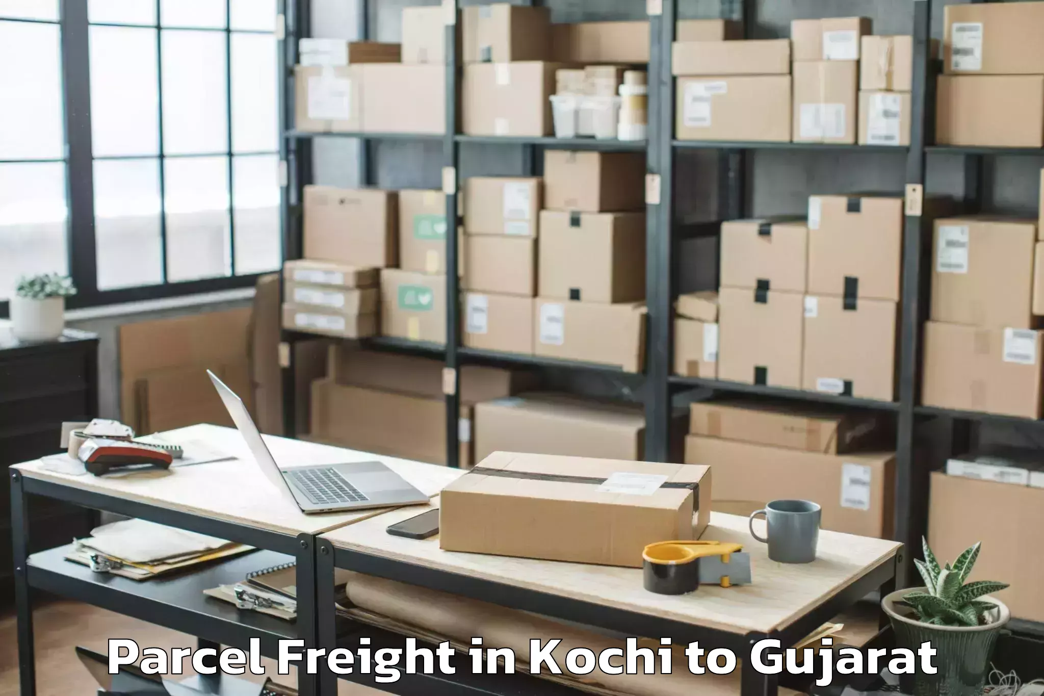 Book Kochi to Lunawada Parcel Freight Online